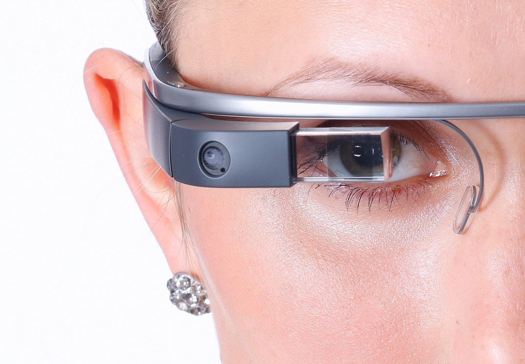 Closeup of a face of a woman wearing Google Glass